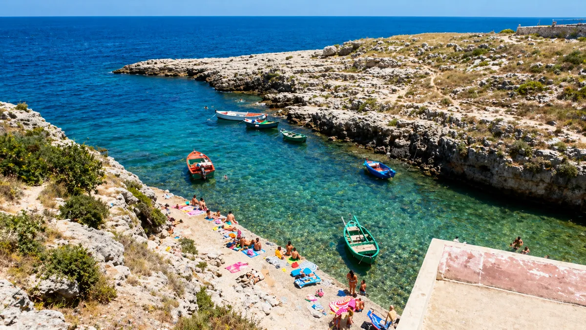 Clear calm water at Cala Port'Alga sheltered bay near Polignano