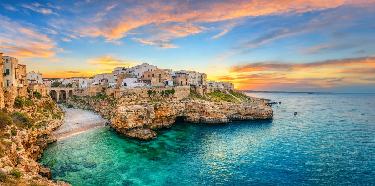 Limestone cliffs above Cala Paura cove in Polignano a Mare